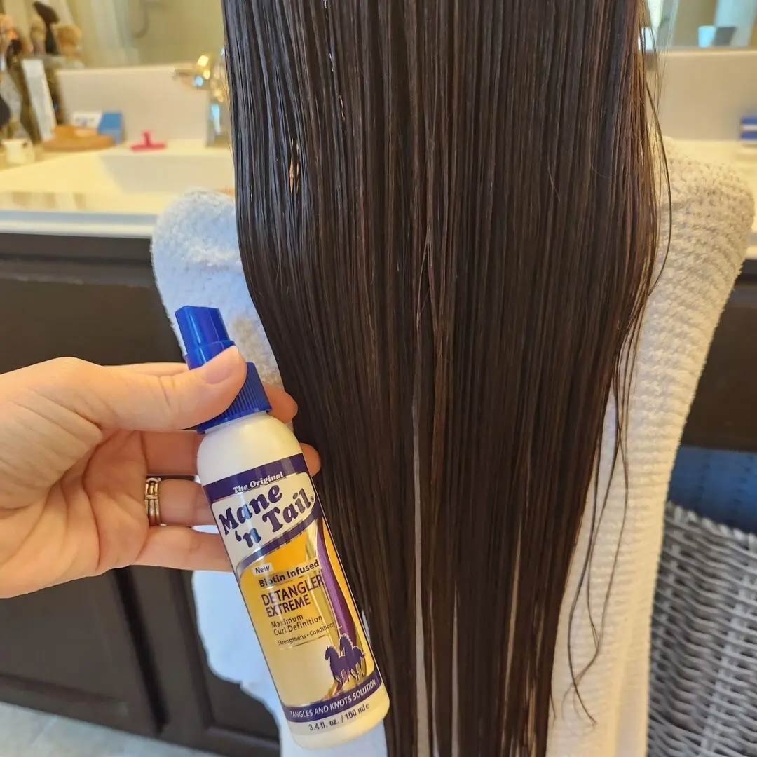 A girls hair that has been freshly brushed with Mane 'n Tail Extreme Detangler. The hair is straight and wet